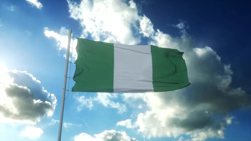 flag nigeria waving wind against beautiful blue sky 3d illustration jpg