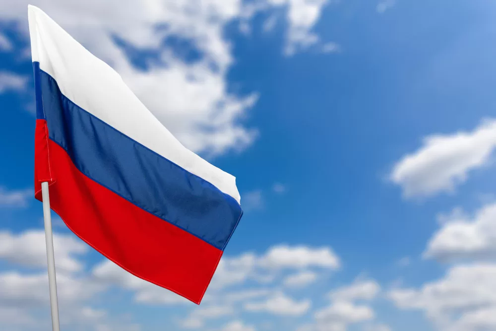 russian flag against blue sky jpg